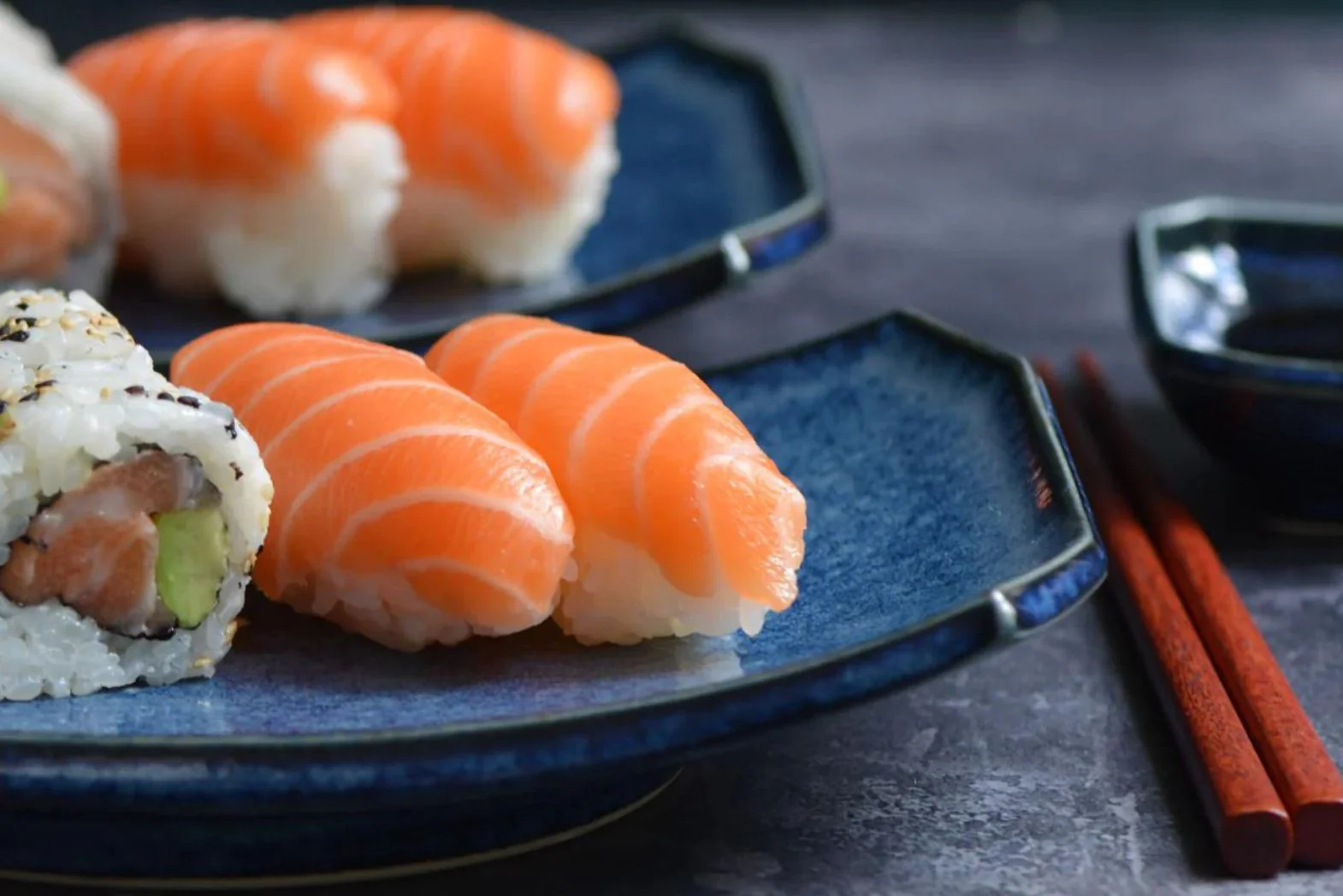 Sushi varieties including nigiri and uramaki rolls, representing authentic Japanese cuisine for the food stall model