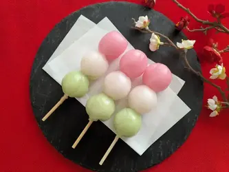 Dango - traditional Japanese sweet dumplings on skewers, added to enhance the food stall's wall decoration